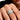 Man's hand wearing the men's adjustable silver-tone ring with a large cubic zirconia center stone