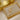 Gold-tone butterfly tassel necklace in a gold-framed display box