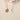 Custom birthstone flower pendant necklace styled on a model